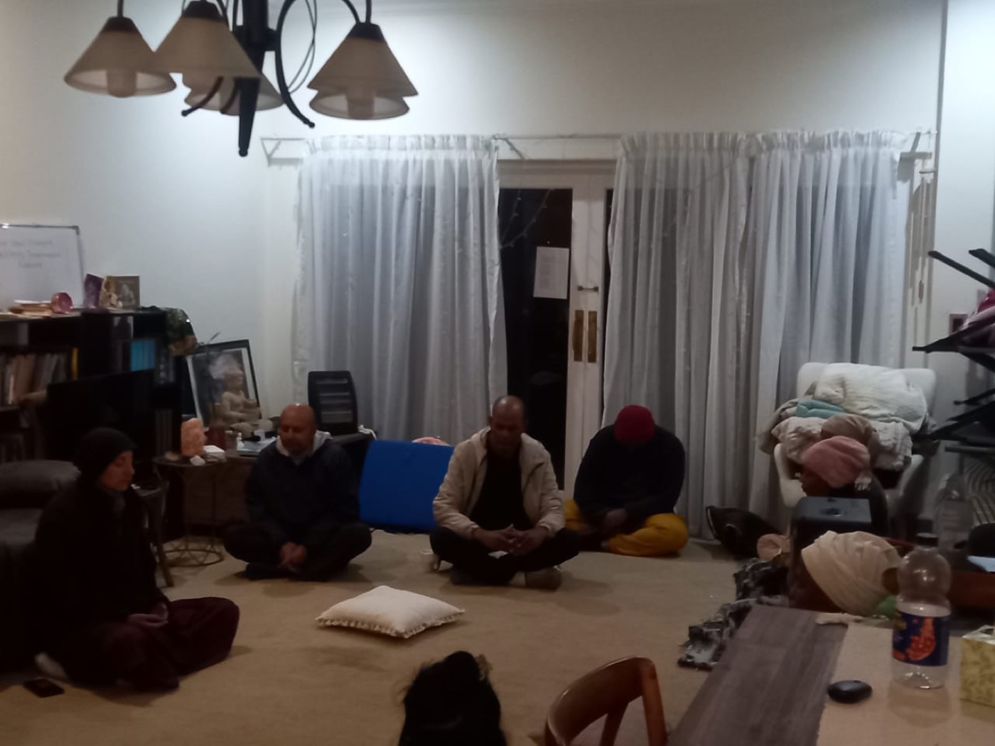 Retreat participants seated together in meditation.