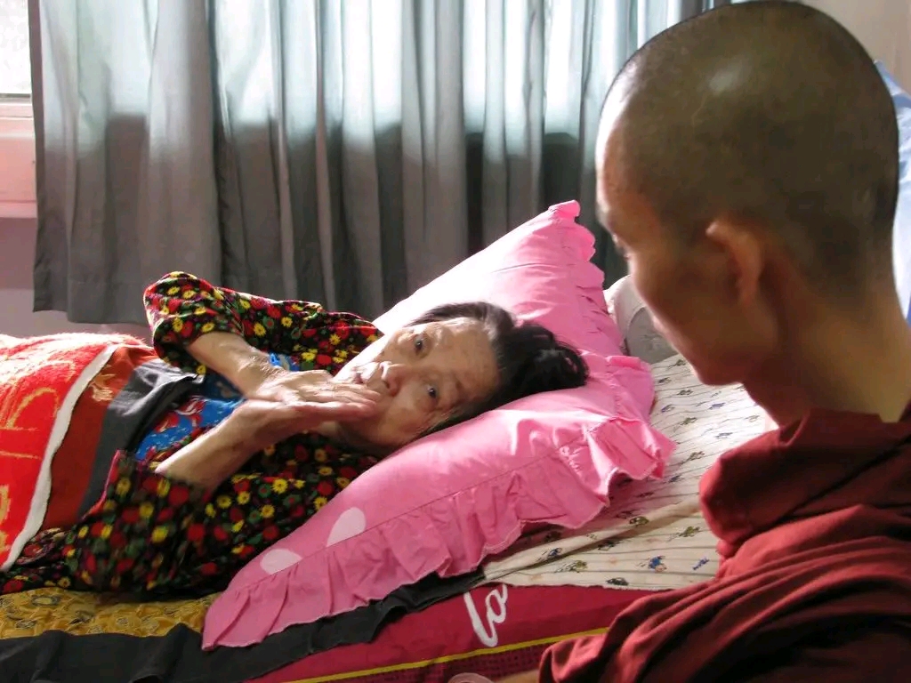 Sayadaw Ashin Ottamathara seated with other monastics.